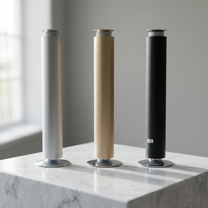 NASS Axis scent diffusers - silver, gold and black on marble