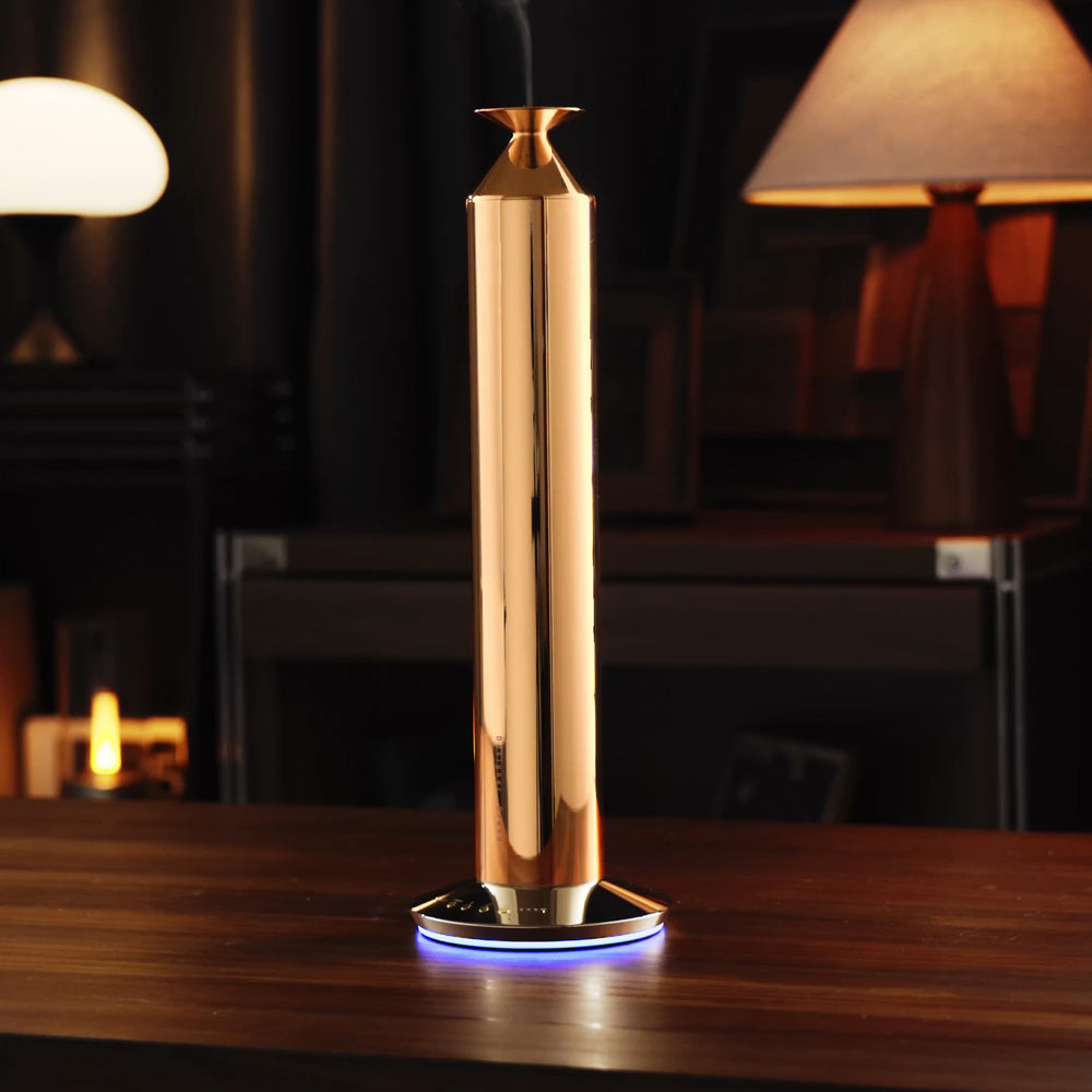 NASS Majestic scent diffuser - gold in an evening living room