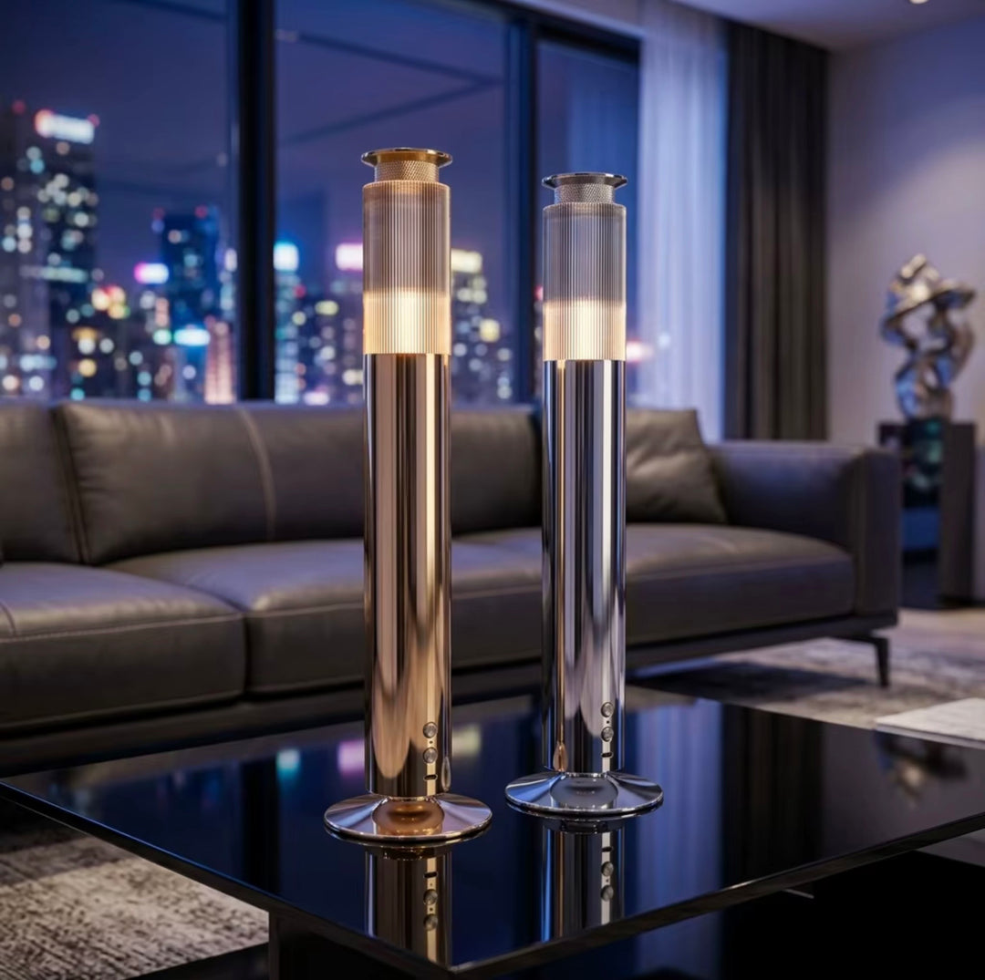 NASS Vertex scent diffusers in gold and silver in a living room at night