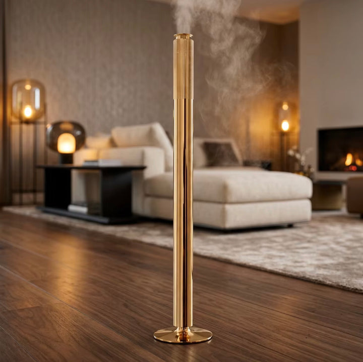 NASS Vertex Tower scent diffuser in gold in a living room